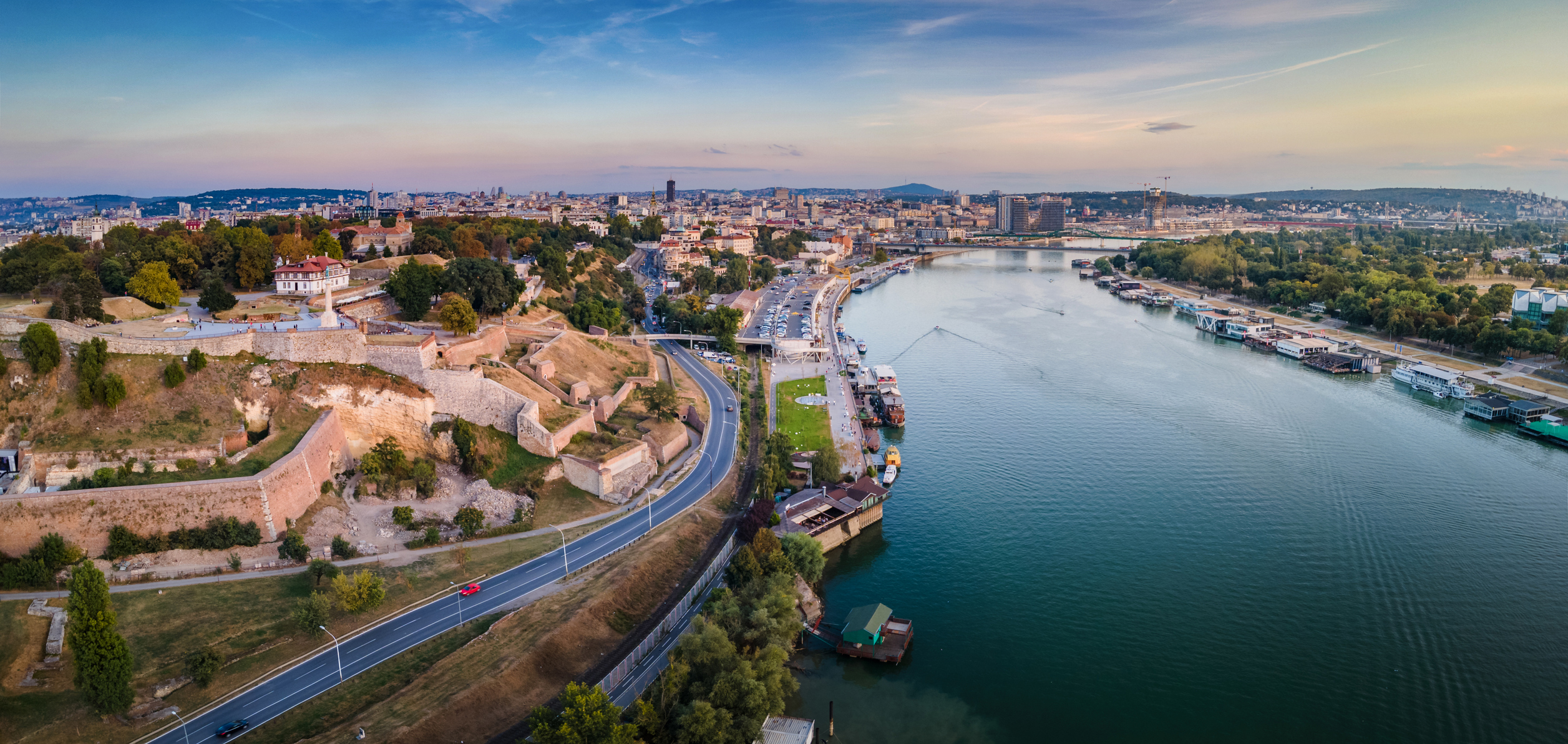 Aerial view of Kalemegdan fort and old town of Belgrade, the capital city of Serbia by the Sava river at sunset. Landmark city view and Europe travel abstract